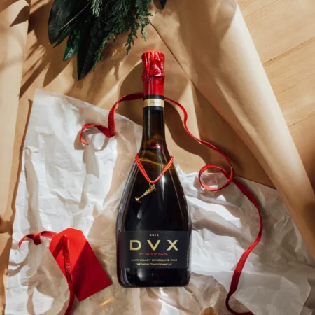 Gift-wrapped bottle of Mumm Napa DVX sparkling wine